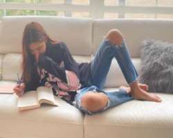 Reading books is her favorite pastime. 